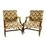 Two similar George III mahogany Gainsborough chairs,each with zigzag upholstery, raised on