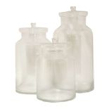 A set of three graduated clear glass jars,the largest 53cm highthe smallest 35cm high (3)