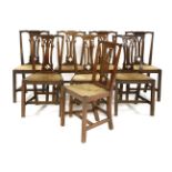 A harlequin set of eight elm and mahogany dining chairs,with rush seats (8)Provenance: The Priory,