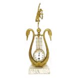 A gilt metal lyre-form mantel clock,in the form of two swans with a figure carrying a torch,54cm