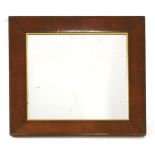 A wall mirror,the square plate in a broad swept mahogany frame,80.5cm wide77cm high