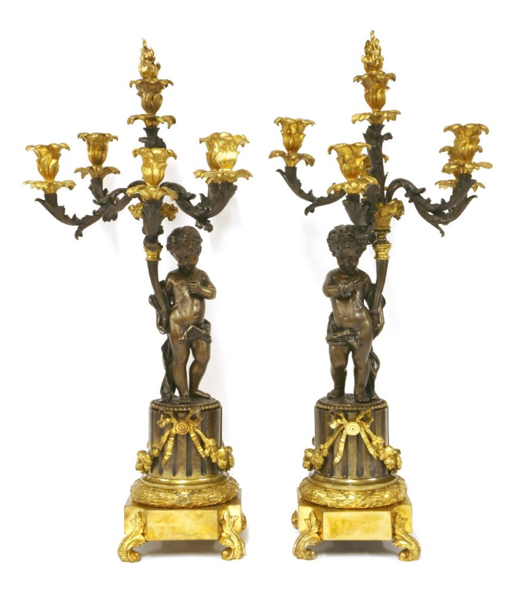 A pair of bronze and ormolu five-light candelabra,the stylised foliate arms supported by putti