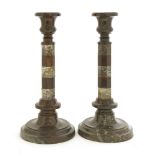 A pair of Victorian marble candlesticks,the octagonal columns with banded decoration on turned,