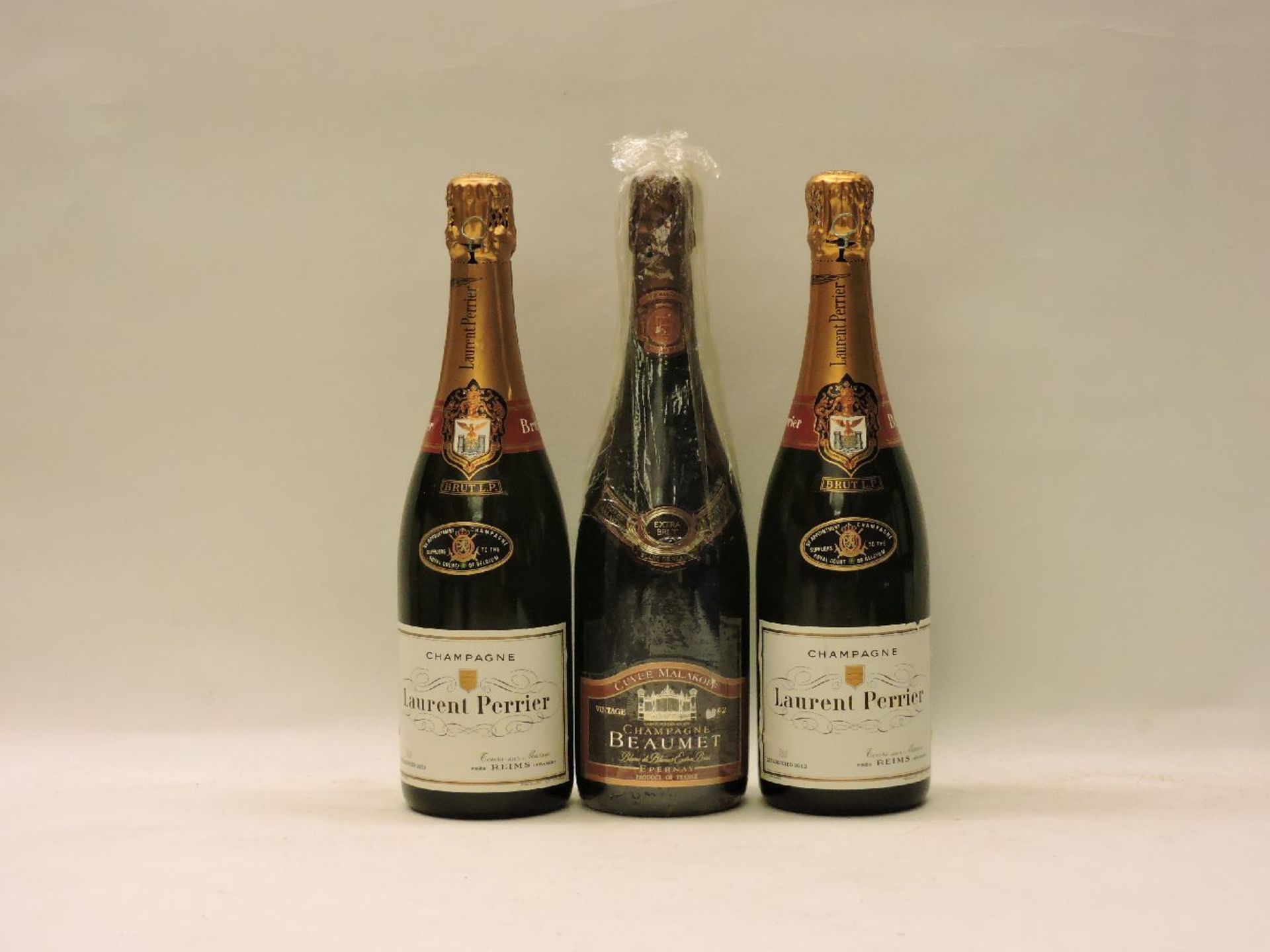 Assorted to include: Laurent Perrier, two bottles; Champagne Beaumet, Cuvée Malakoff, ?1982?, one