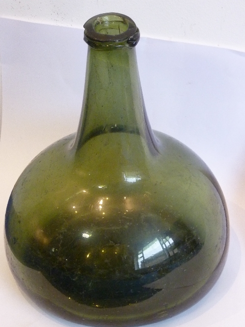 An 18th century onion-shaped green glass Wine Bottle (possibly Dutch), 17.