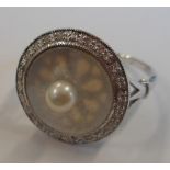 An unusual 18-carat white gold, pearl,