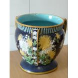 ADDED LOT A large 19th century three-handled Majolica Planter decorated in relief with