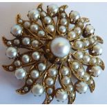 A 19th century yellow metal Brooch, mounted with pearls in a flower head style design,