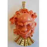 An unusual 18-carat gold and carved (signed) coral Pendant/Brooch set with diamonds