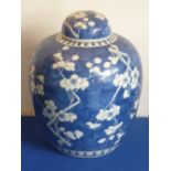 A late-19th/early-20th century Chinese porcelain Jar and Cover hand-decorated in Kangxi style with