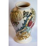 A modern Moorcrft pottery Vase of baluster section, tube lined and hand-decorated with tulips,