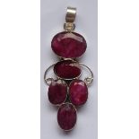 A modern designer silver pendant set with five large hand-cut oval low-grade rubies, 5.
