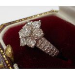 A fine quality platinum set 'daisy' diamond Cluster Ring, 43 diamonds,