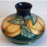A modern Moorcroft pottery Vase of squat baluster form, tube lined and hand-decorated with peaches,