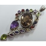 A fine large and heavy handmade silver Pendant set with a multitude of varying sized and coloured