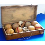 A cased wooden Bowls Set, eight bowls, a jack, a Pin etc.