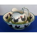 A Wemyss pottery Jug and Bowl decorated with a continuous band of chickens etc.