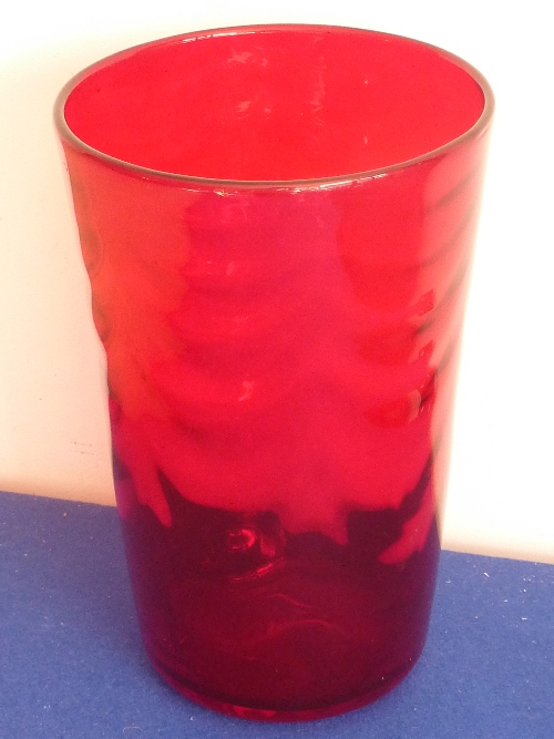 A Whitefriars ruby red tapering circular glass Vase having a rippled effect to the glass (perfect