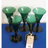 A set of five circa 1820 green wine glasses