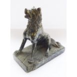 After the antique, a 19th century Serpentine-carved seated hound (2.