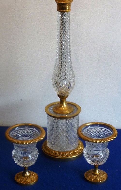 A cut glass and gilt metal mounted lamp together with two matching Campana-style urns,