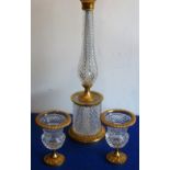 A cut glass and gilt metal mounted lamp together with two matching Campana-style urns,