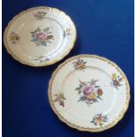 A pair of early 19th century Coalport cabinet plates, each with raised decoration in relief,
