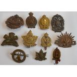 Eleven foreign and Commonwealth cap badges: Canada Overseas 211;