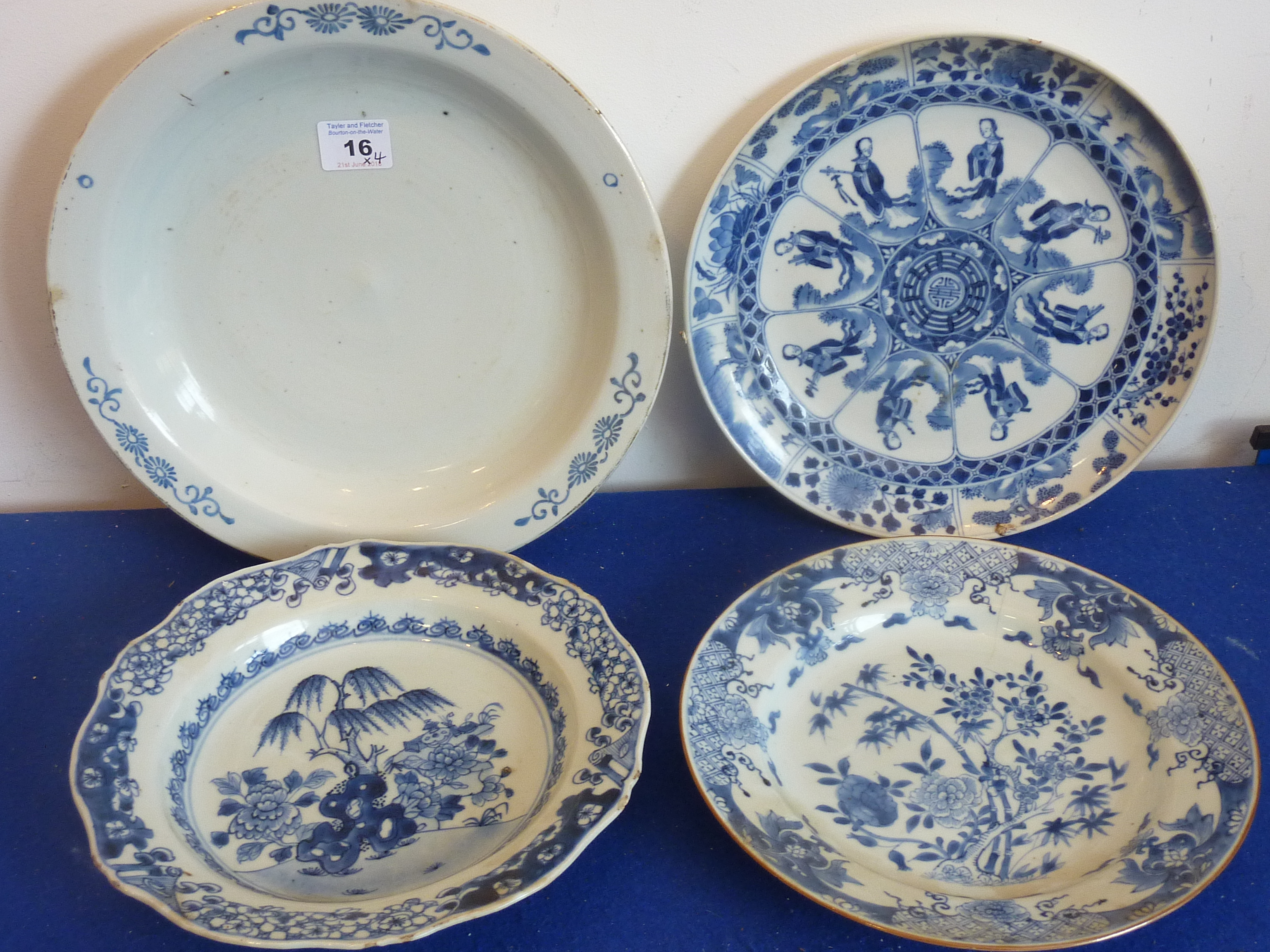 Four Chinese porcelain plates: one painted in underglaze blue with panels of female musicians and