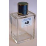 An Art Deco silver and enamel topped glass perfume bottle,