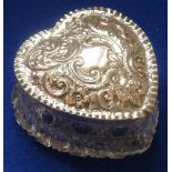 An Edwardian heart-shaped cut glass Trinket Box with hallmarked silver lid decorated repoussé style