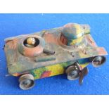 An early 20th century tinplate clockwork Tank painted in camouflage colours,