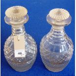 A good pair of Regency period wine decanters each having extensive diamond and hobnail cutting,