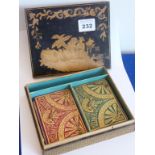 A Chinese-style penwork box containing two packs of Bezique cards and two original gilded markers