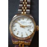 A ladies bimetal Rolex Oyster Perpetual Date wristwatch with baton markers and the date aperture at