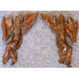 An opposing pair of early-style carved wood Angel Scribes,