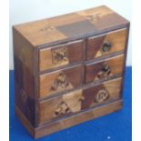 A late 19th/early 20th Century Japanese parquetry miniature Chest on plinth base,