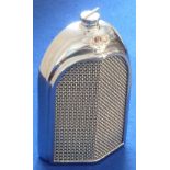 A stylish steel Decanter modelled as a Bentley radiator grill, the reverse marked Ruddspeed Ltd.