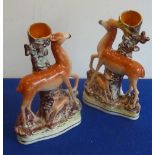 A pair of 19th century Staffordshire flatback Spill Vases modelled as stag and hind with fawn etc.