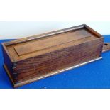 A large 19th century hanging oak Candle Box having a fielded panel slide, of good colour,