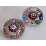 Two miniature Clichy paperweights with millefiori-style canes etc.; the larger, 4.