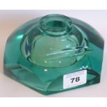 A faceted, hexagonal, green glass inkwell having 'carved-out' pen-rest,