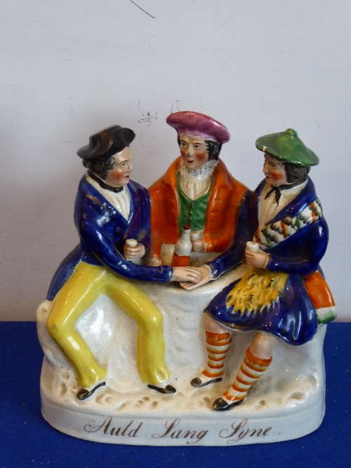 A 19th century Staffordshire figure group, Auld Lang Syne,