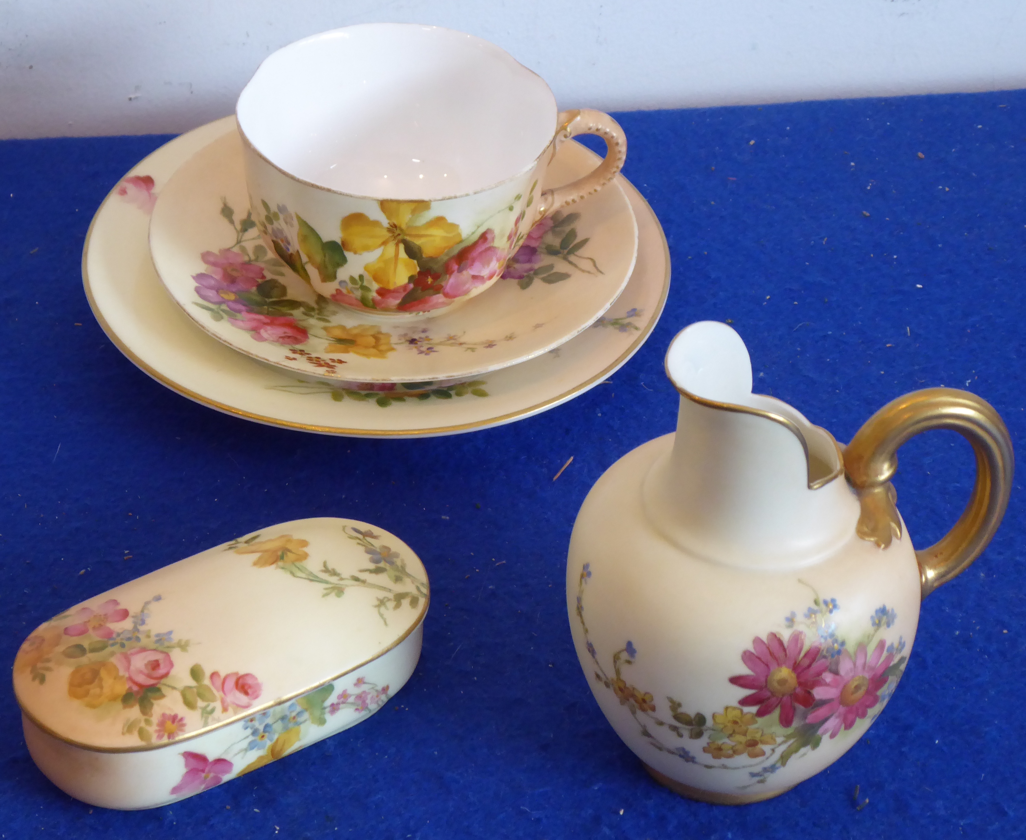 A Royal Worcester group to include a trio,