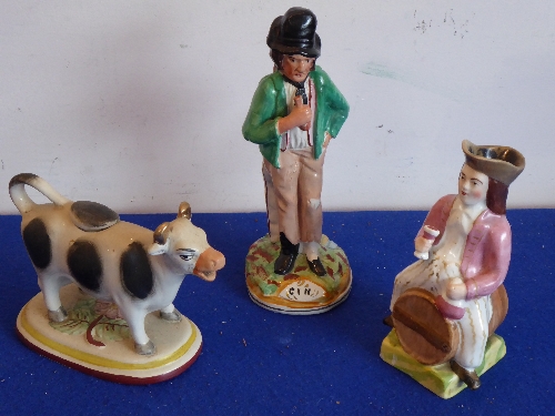 Three pieces of 19th century Staffordshire to include a cow creamer and Gin/Water