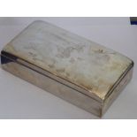 A silver cigarette case; the hinged lid engraved with a stylised S,