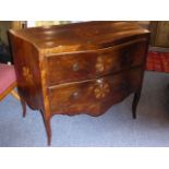 A late 18th/early 19th century serpentine-fronted Continental walnut commode;