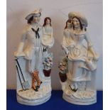 A pair of Staffordshire flat back figures as a male and female carrying children and gardening,