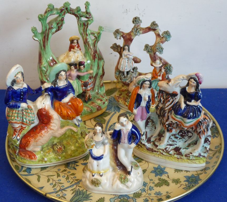 Five various 19th century Staffordshire groups to include a bocage-style model with two figures