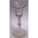 An 18th century style wine glass;